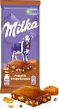 Шоколад Milka Молочный с арахисом и кусочками хрустящей карамели 90г